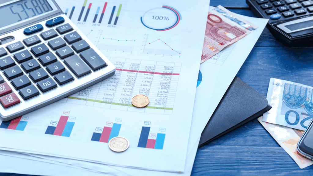 Calculator euro bills and charts on a desk