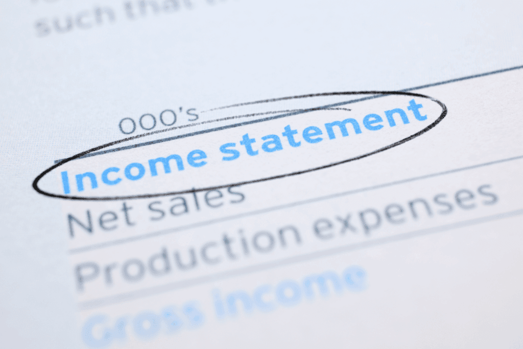Close up of a paper with Income Statement circled showing financial report details