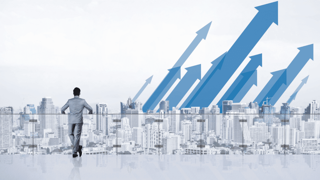 Man overlooking city with upward arrows in the sky