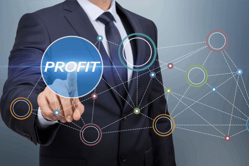 A businessman in a suit touches a digital screen with the word “PROFIT”, surrounded by connected circular nodes