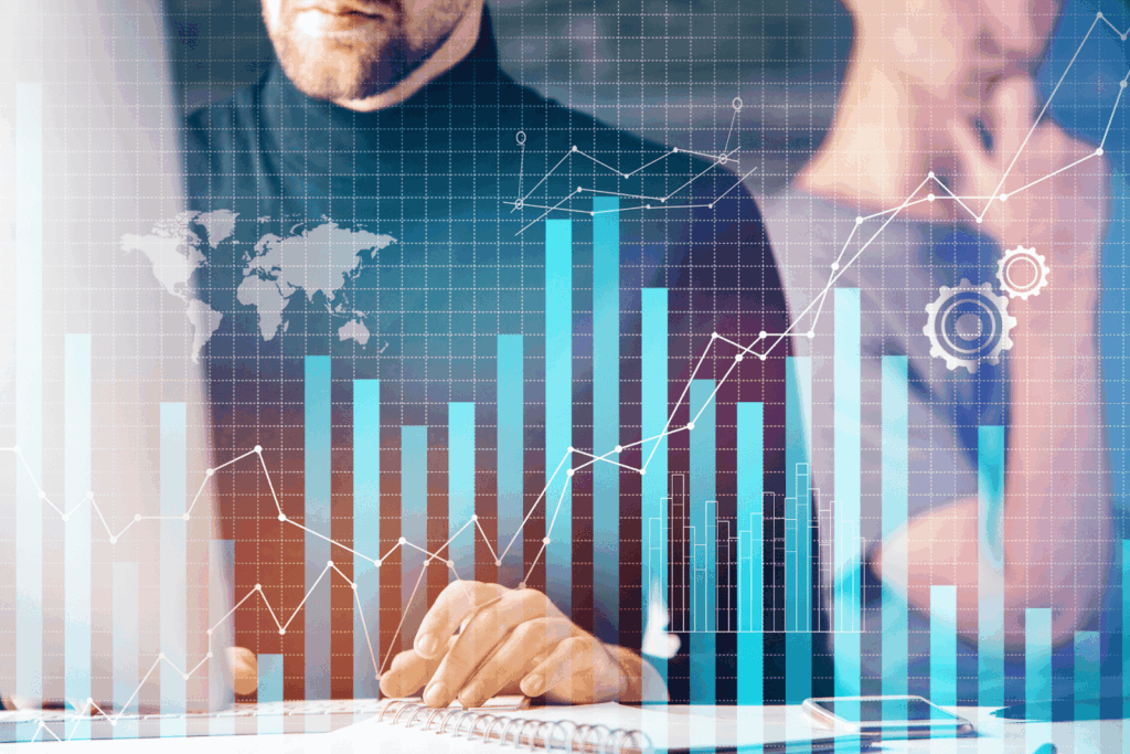 Man reviewing data with overlaid digital bar and line graphs.