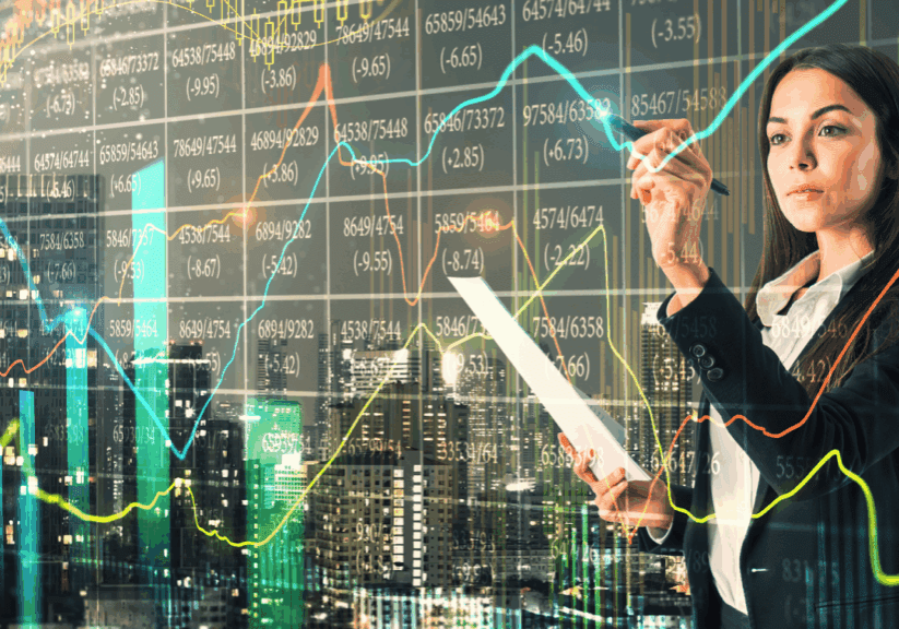 Businesswoman analyzing stock market graphs over city background