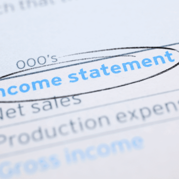 Close up of a paper with Income Statement circled showing financial report details