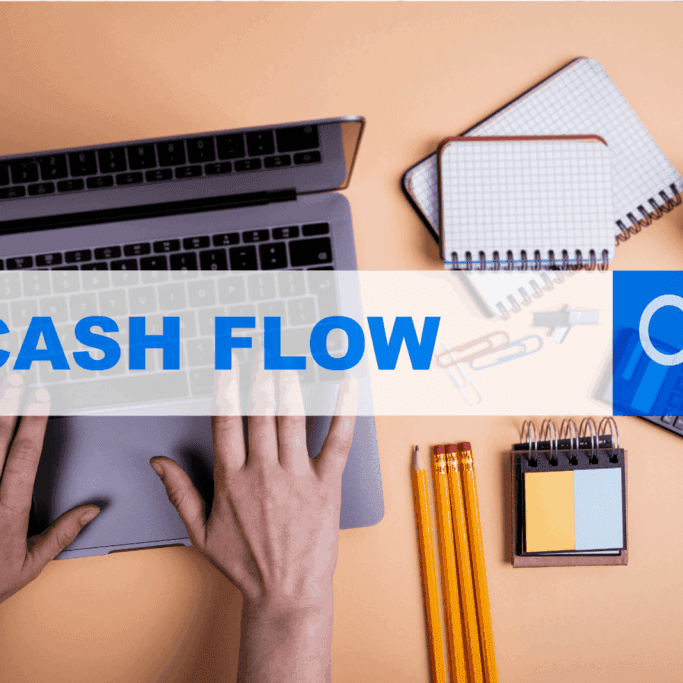 Hands typing on a laptop with Cash Flow text overlay