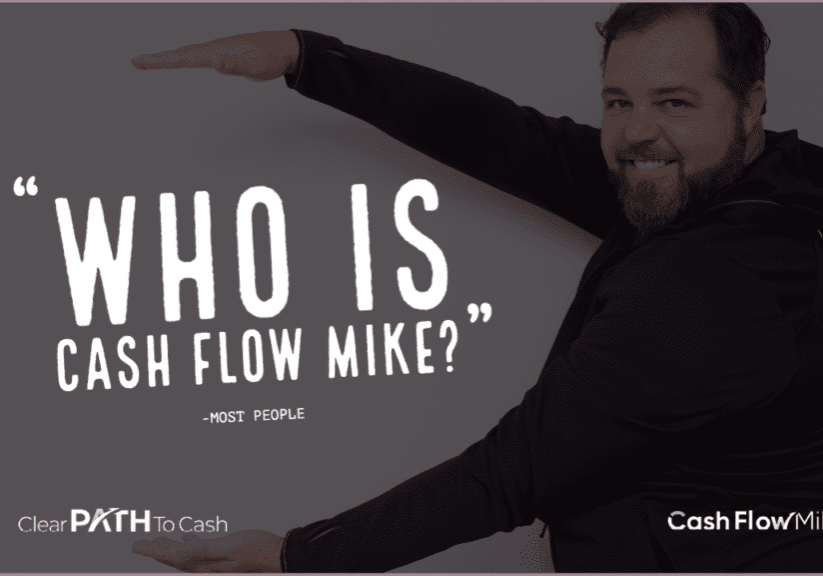 A man holding a who is cash flow mike font