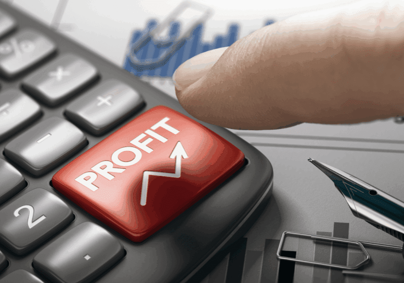 Finger pressing a red calculator button labeled 'PROFIT'