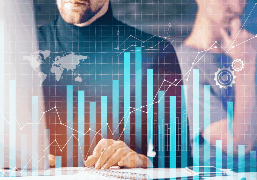 Man reviewing data with overlaid digital bar and line graphs.